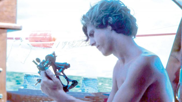 A young Stan Honey Navigating with a sextant in the early days of his career