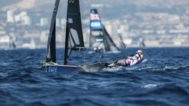 Athletes leaning on the course