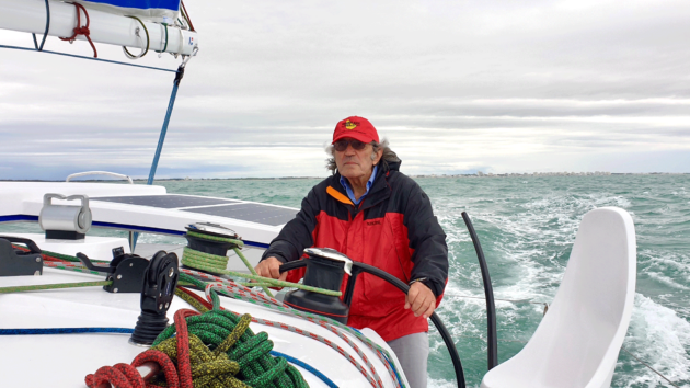 Cornell at the wheel of Aventura Zero, the bespoke Outremer 45 he planned to sail round the world using only electric power without having to rely on any fossil fuels