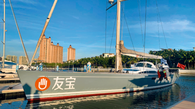 Swan 82 with blue sky behind