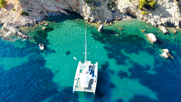 Aerial view of a catamaran at an anchorage